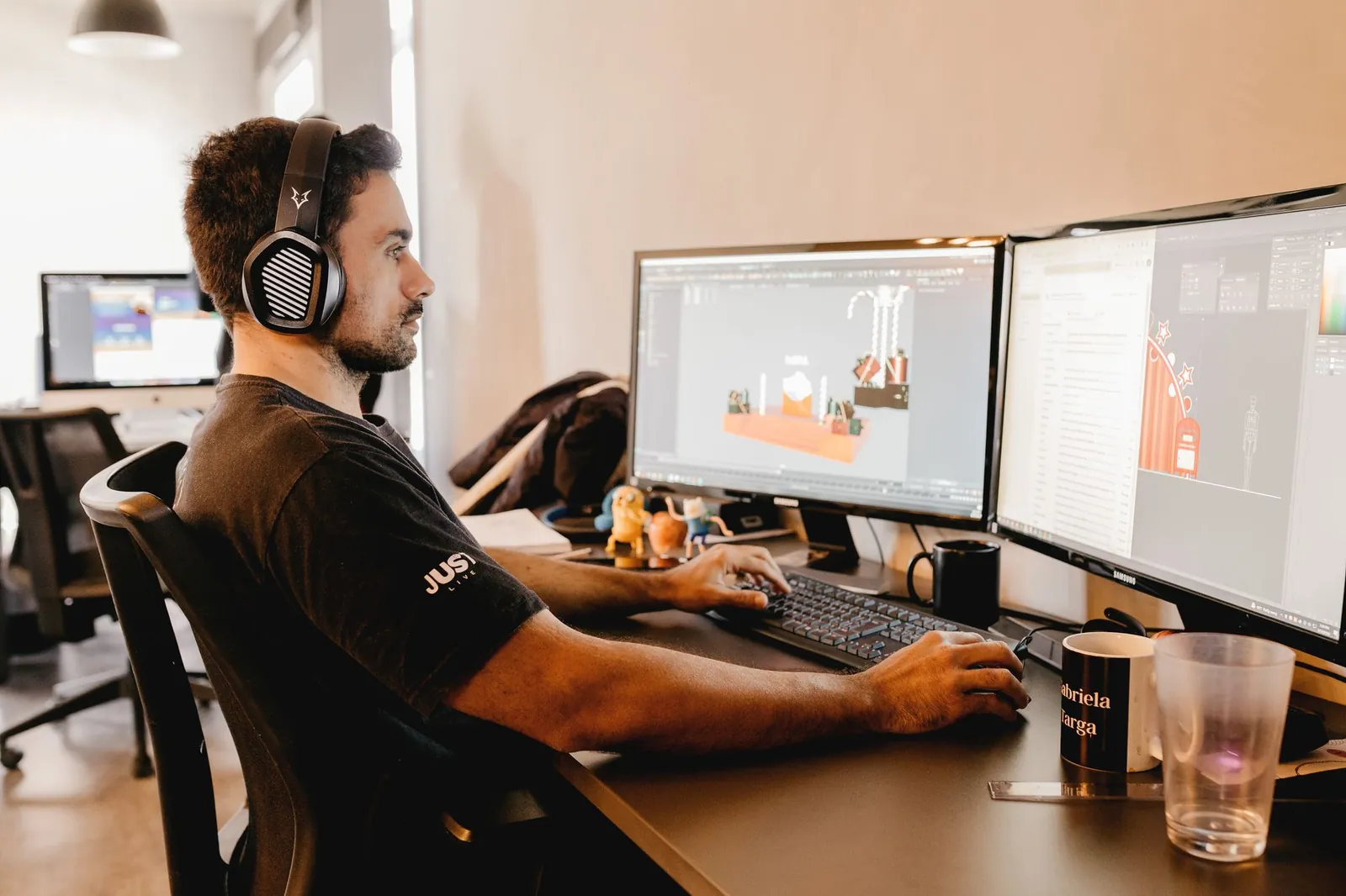 Developers at desks inside a modern open-plan game studio office